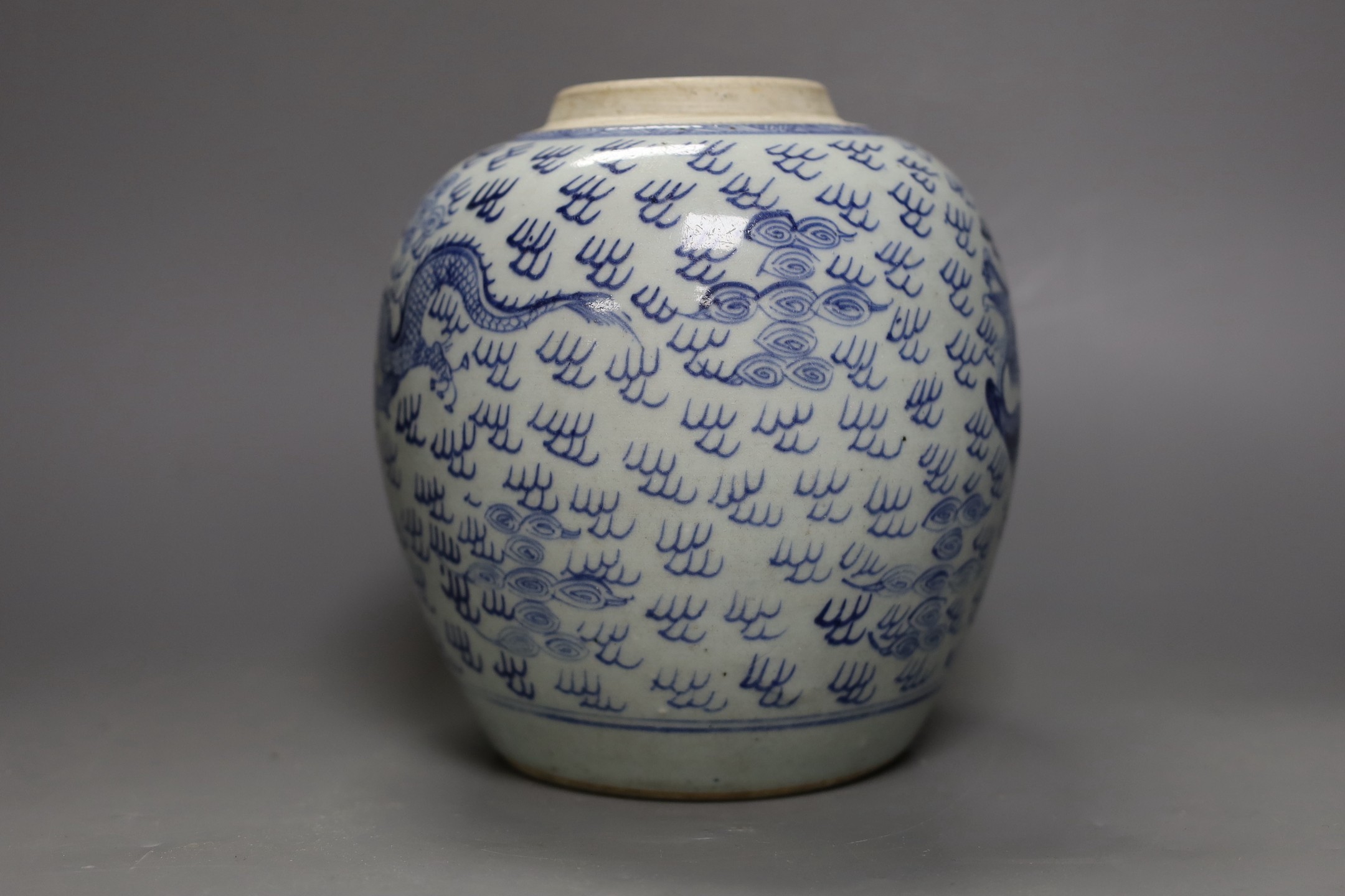 An 18th century Chinese provincial blue and white ‘dragon and phoenix’ jar, 19cm